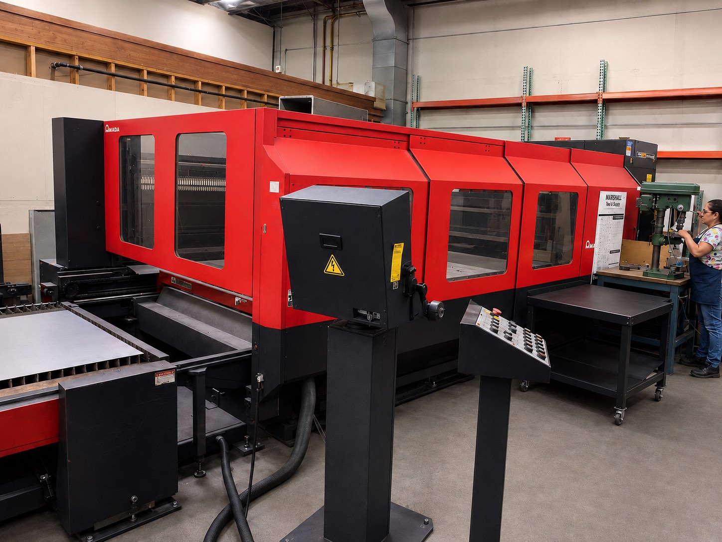 The 4,000-watt Amada laser cutting metal on the floor at Ambor-Palomino Metal Fab in Simi Valley